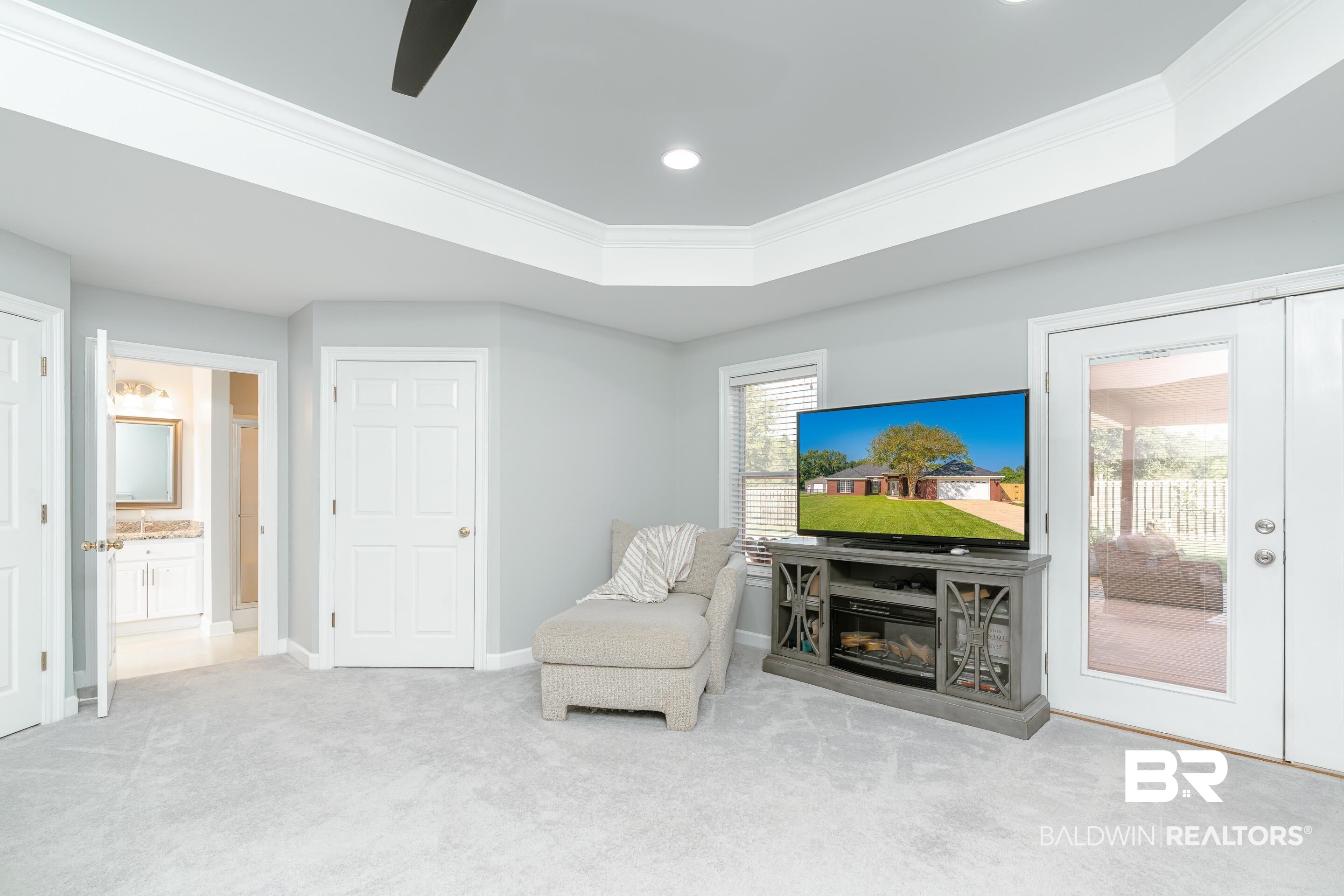 9477 Deerfield Drive Irvington, AL 36544 - Photo 20 of 58 Sitting room with plenty of natural light, carpet, and crown molding