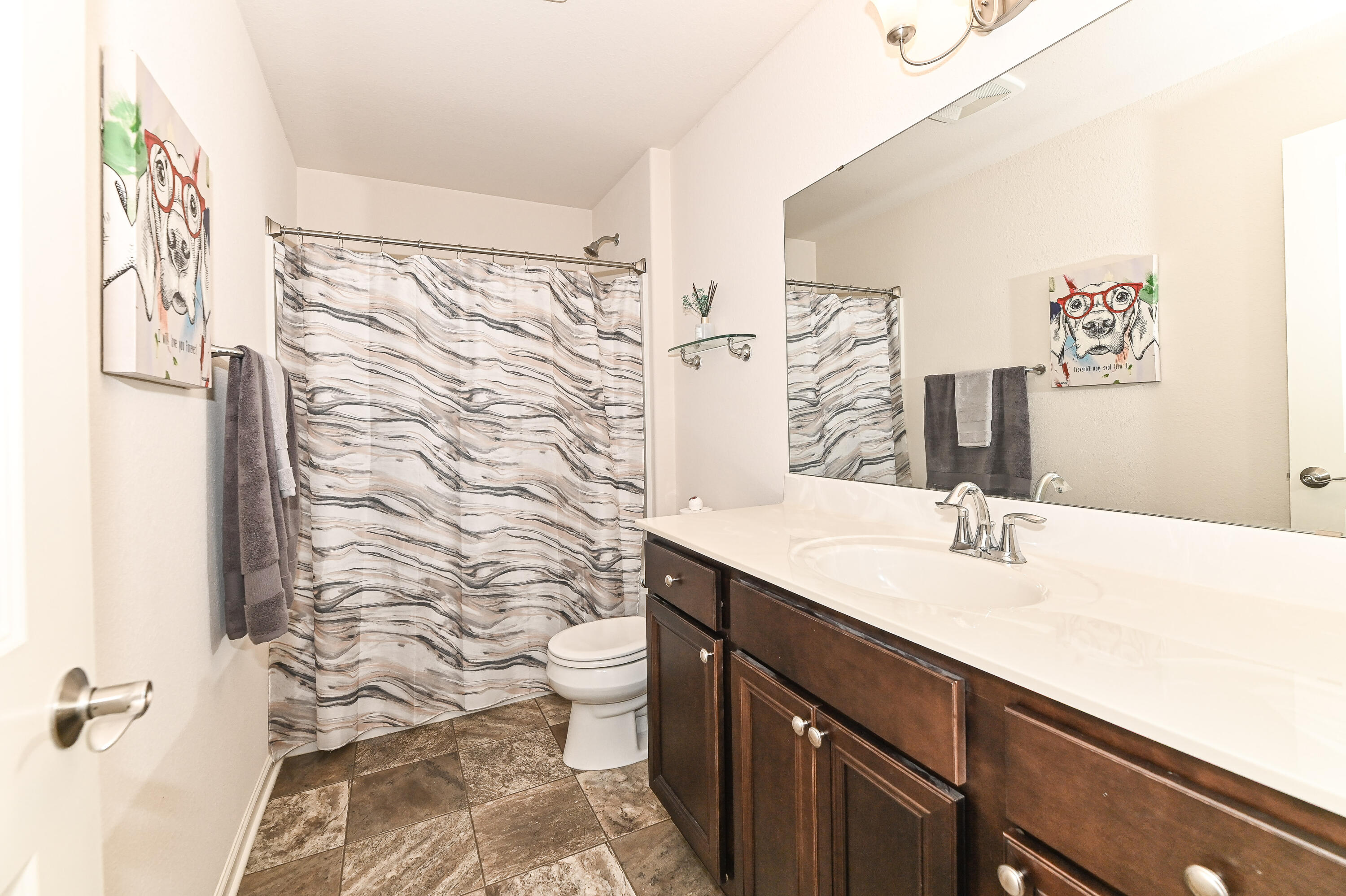 3805 Yates Road Mount Pleasant, WI 53406 - Photo 20 of 27 Spacious second-floor full bath with extended vanity and shower-over-tub combination.