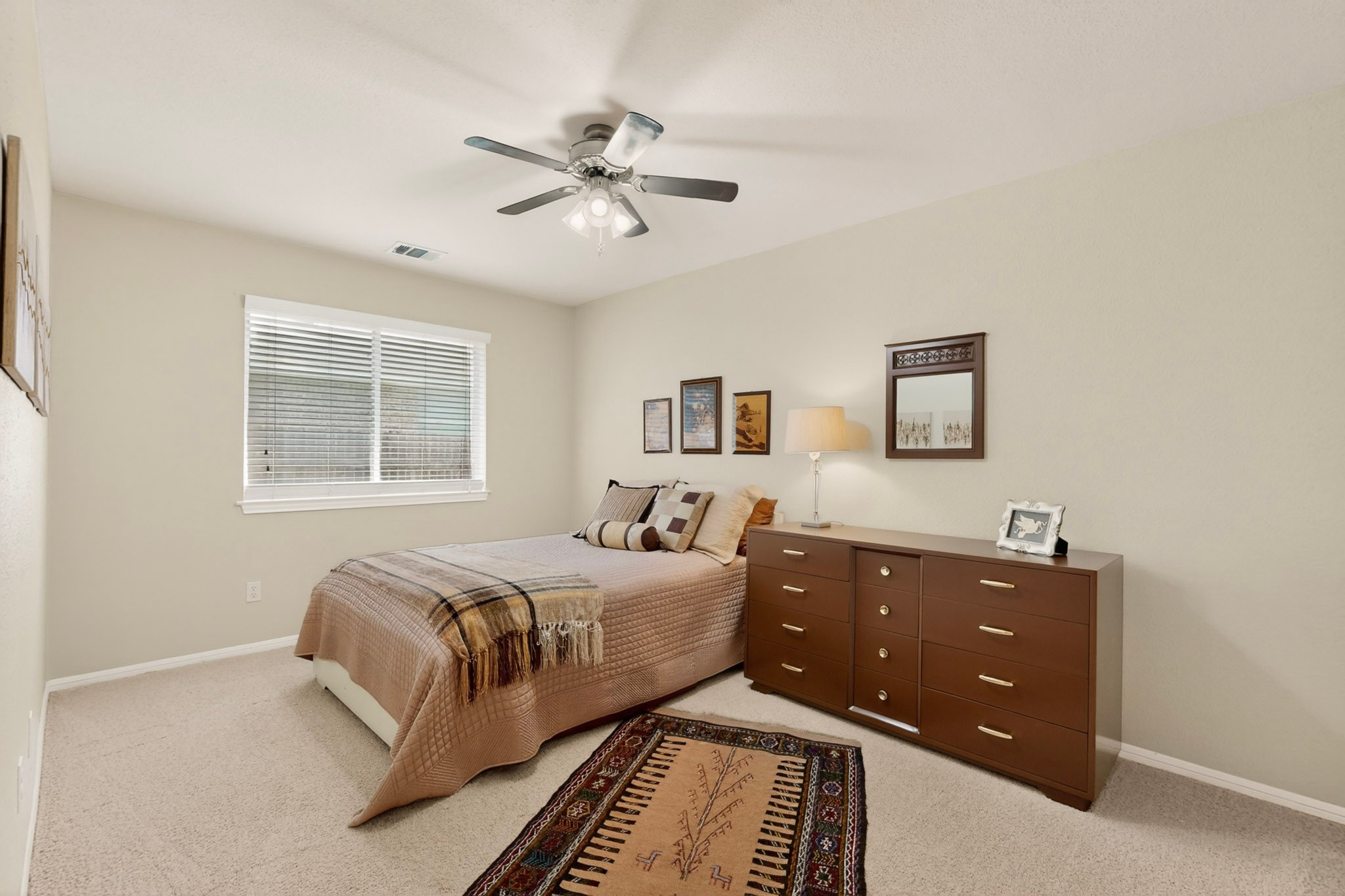905 Victoria Ridge Drive Pflugerville, TX 78660 - Photo 22 of 32 A tranquil bedroom provides comfort with soft lighting and neutral decor.