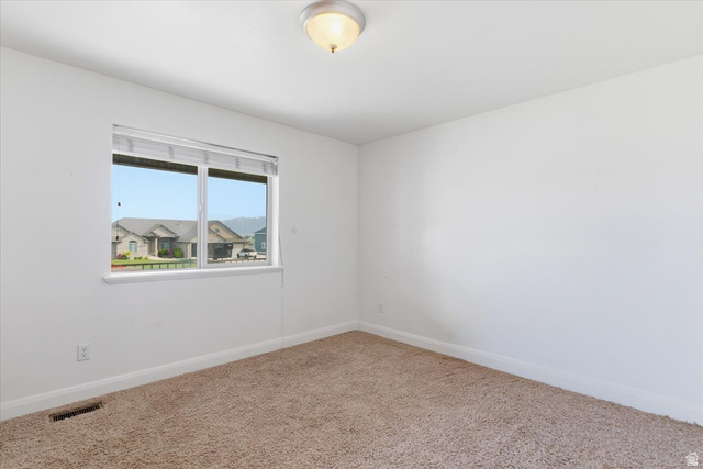 6237 West 4600th Street South Hooper, UT 84315 - Photo 21 of 48 Empty room featuring baseboards and carpet flooring