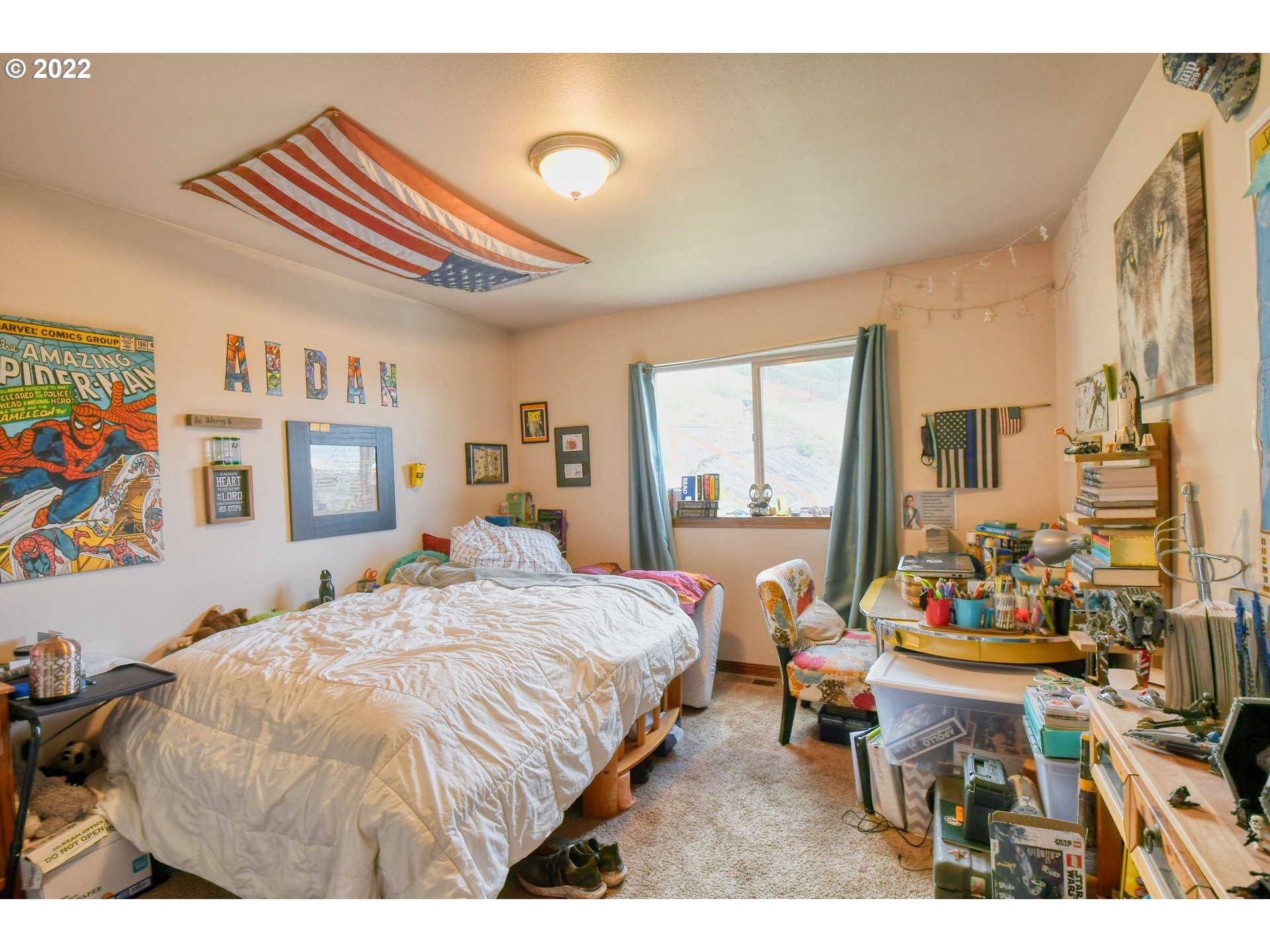 831 South Main Street Pendleton, OR 97801 - Photo 19 of 26 a bedroom with a bed and a large window