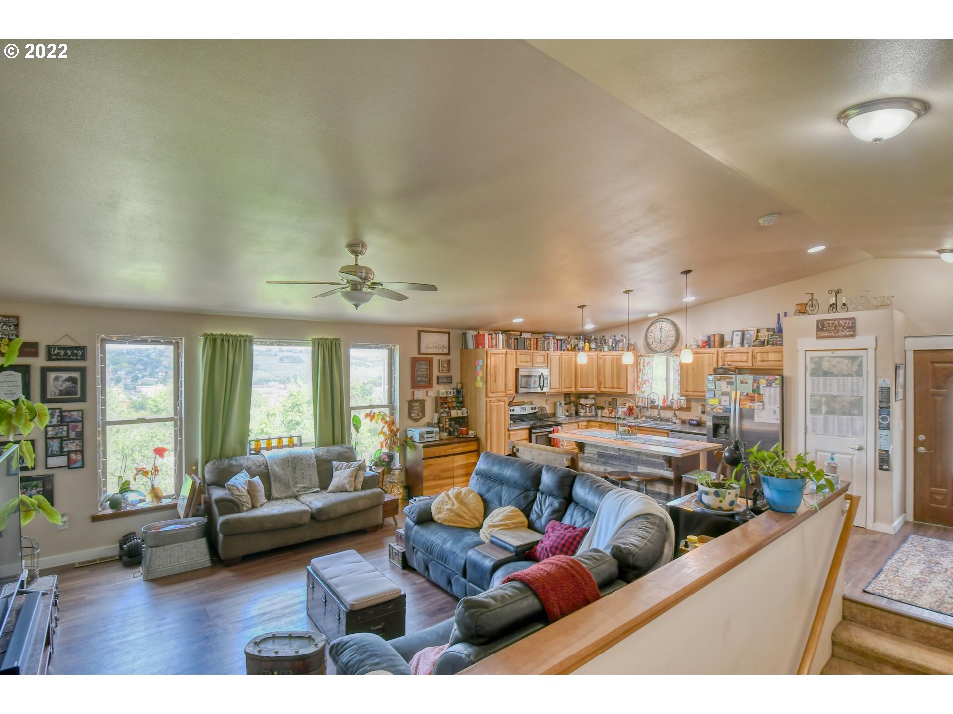 831 South Main Street Pendleton, OR 97801 - Photo 8 of 26 a living room with furniture kitchen view and a large window
