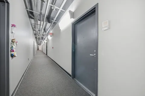 a view of a house with a tree