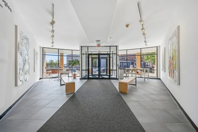 a lobby with furniture and rug
