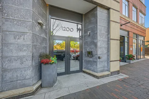 a view of an entryway with a flower garden