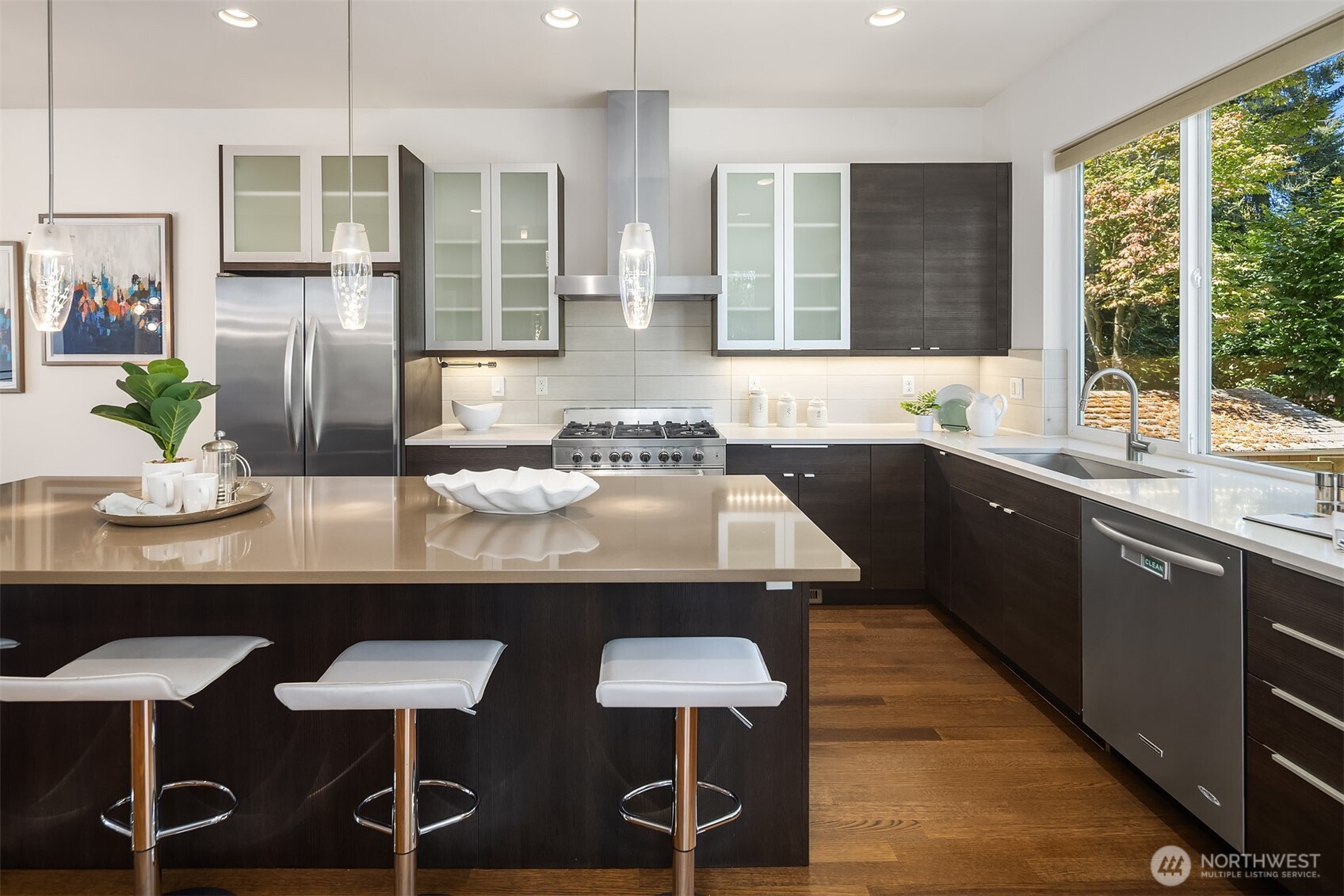 1256 Northeast 89th Street Seattle, WA 98115 - Photo 11 of 37 a kitchen with a table chairs sink and wooden floor