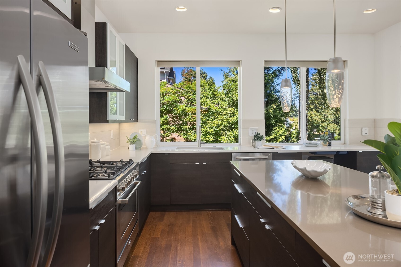 1256 Northeast 89th Street Seattle, WA 98115 - Photo 13 of 37 a kitchen with large windows and refrigerator