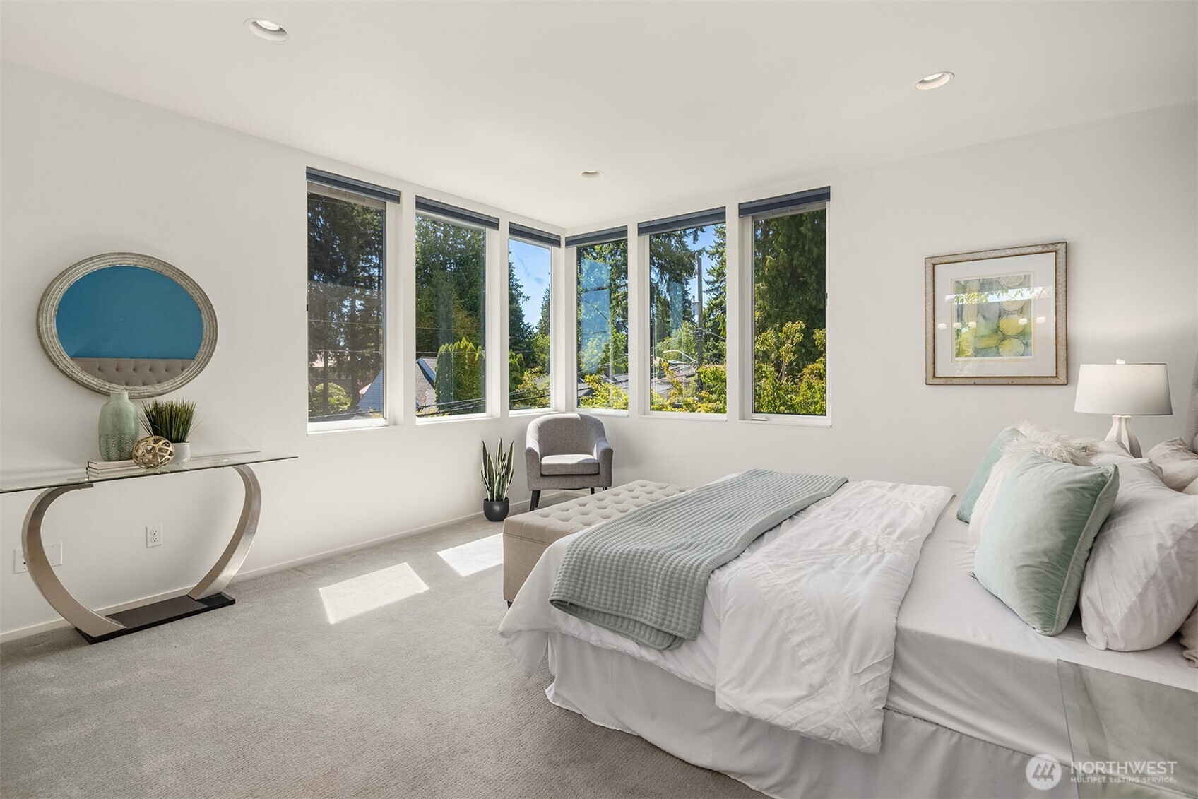 1256 Northeast 89th Street Seattle, WA 98115 - Photo 16 of 37 a spacious bedroom with a bed a couch and a large window