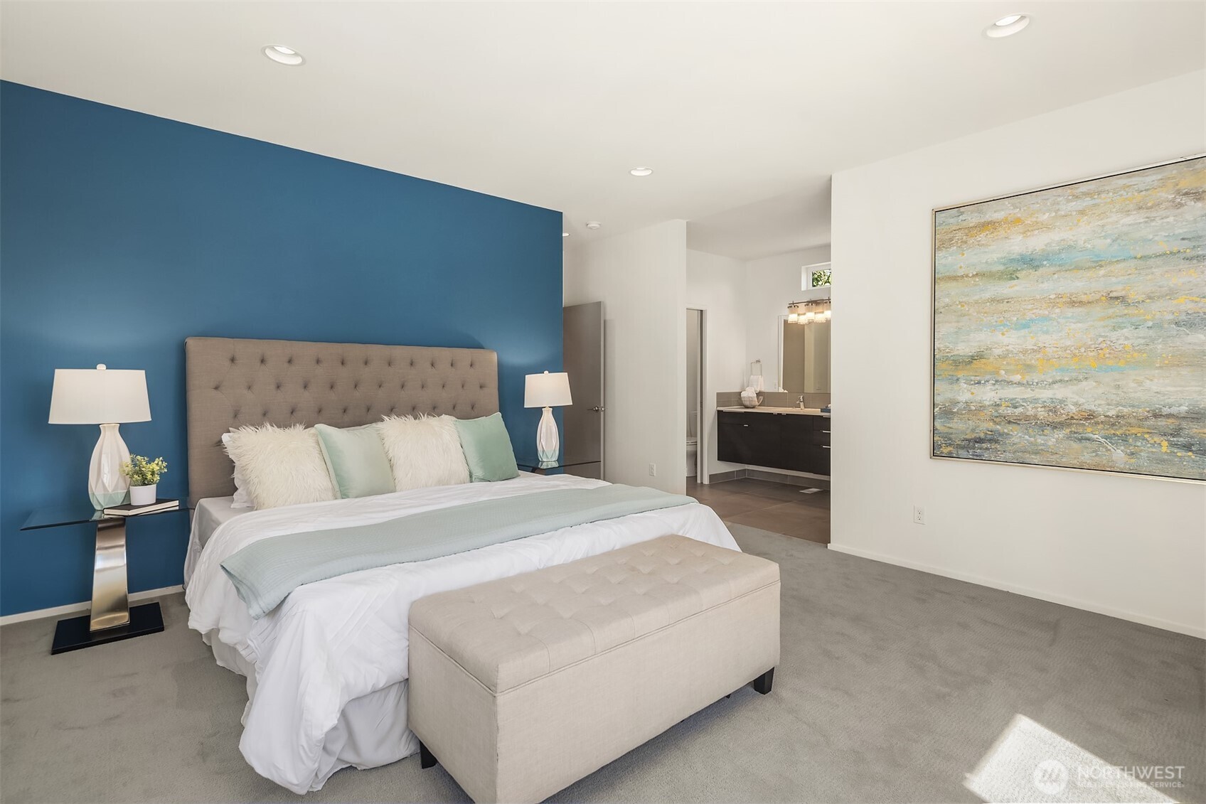 1256 Northeast 89th Street Seattle, WA 98115 - Photo 17 of 37 a spacious bedroom with a bed and painting on the wall