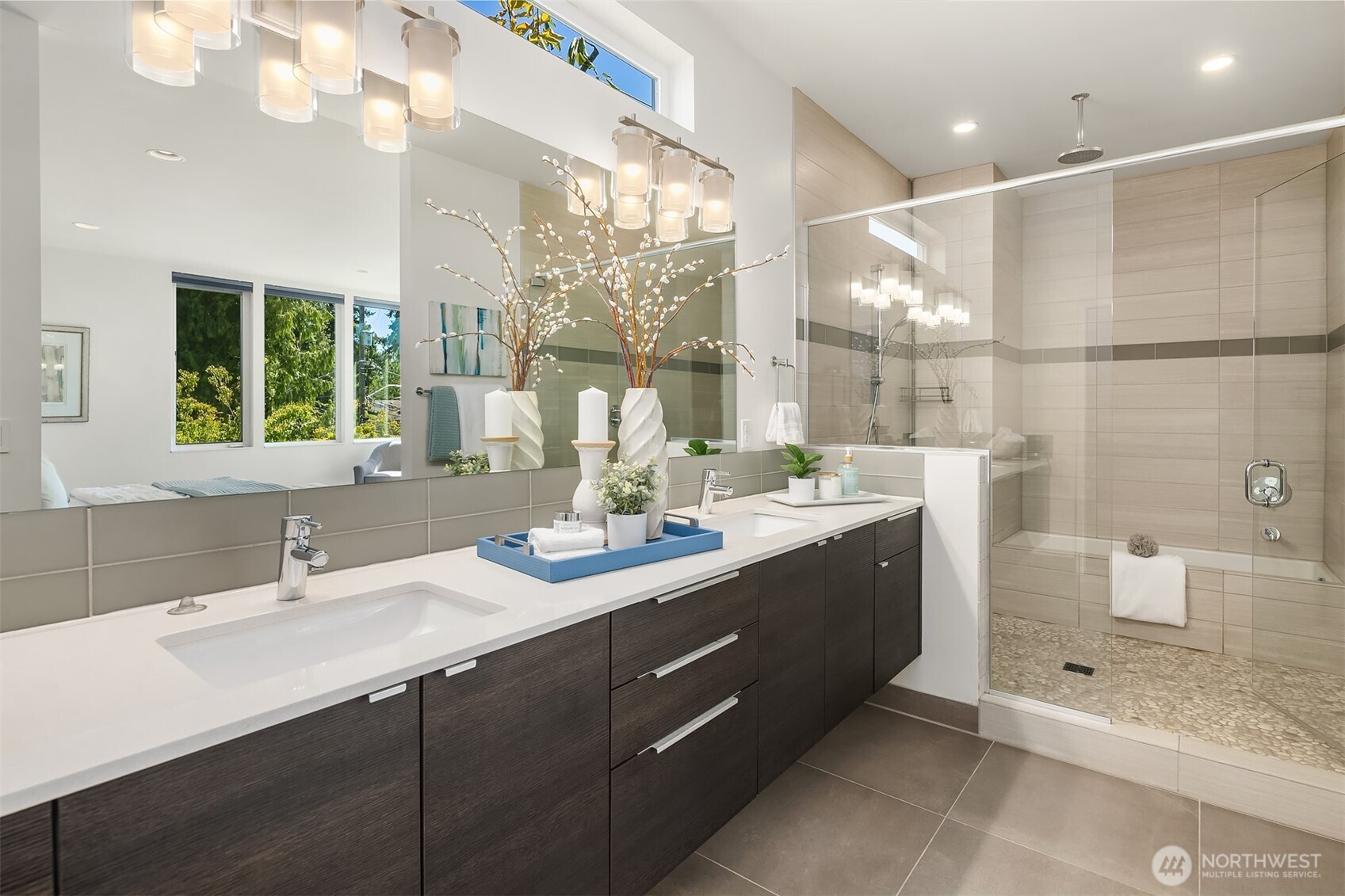 1256 Northeast 89th Street Seattle, WA 98115 - Photo 18 of 37 a bathroom with a sink double vanity and a shower