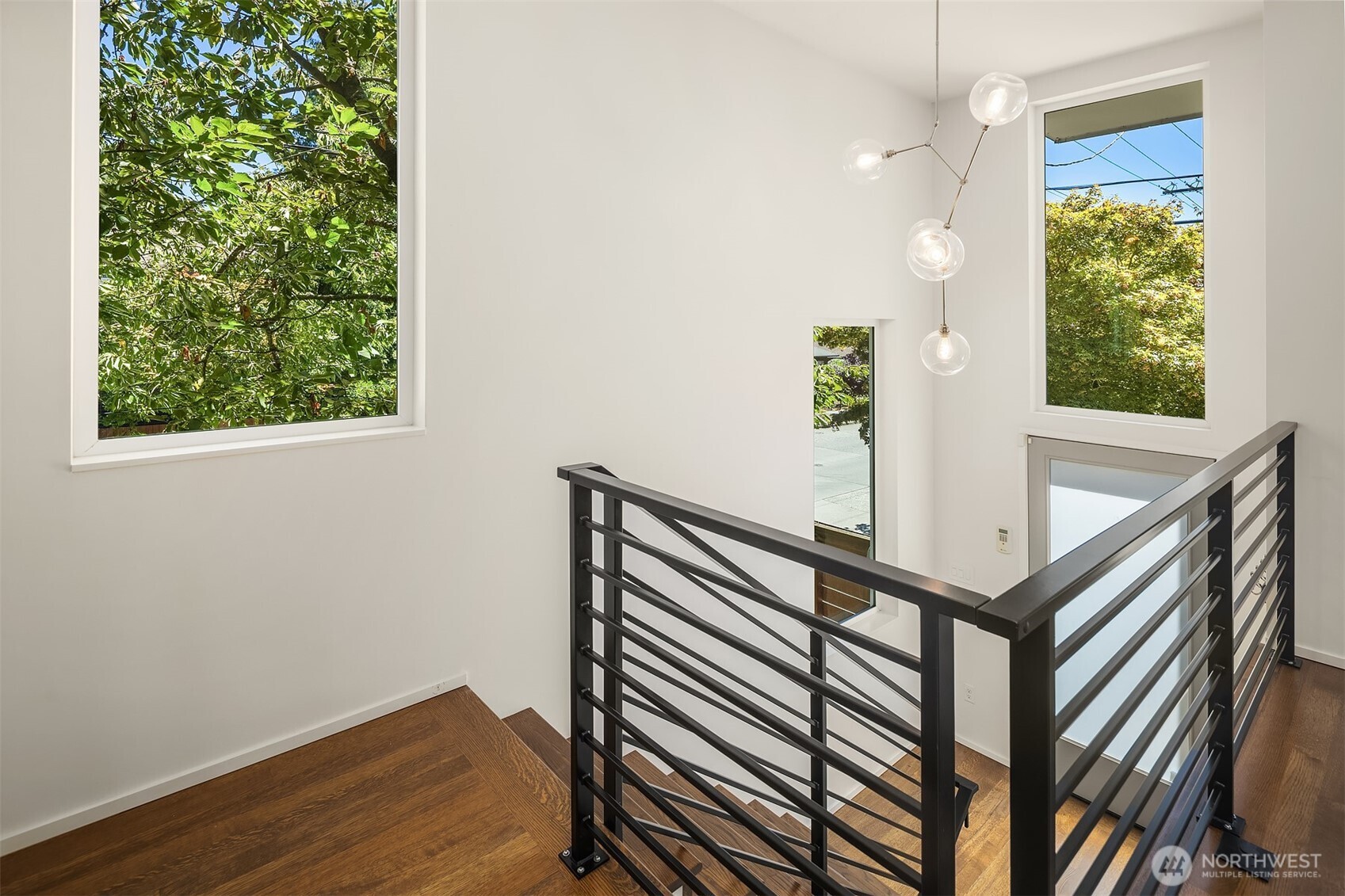 1256 Northeast 89th Street Seattle, WA 98115 - Photo 2 of 37 a view of entryway with a window and wooden floor