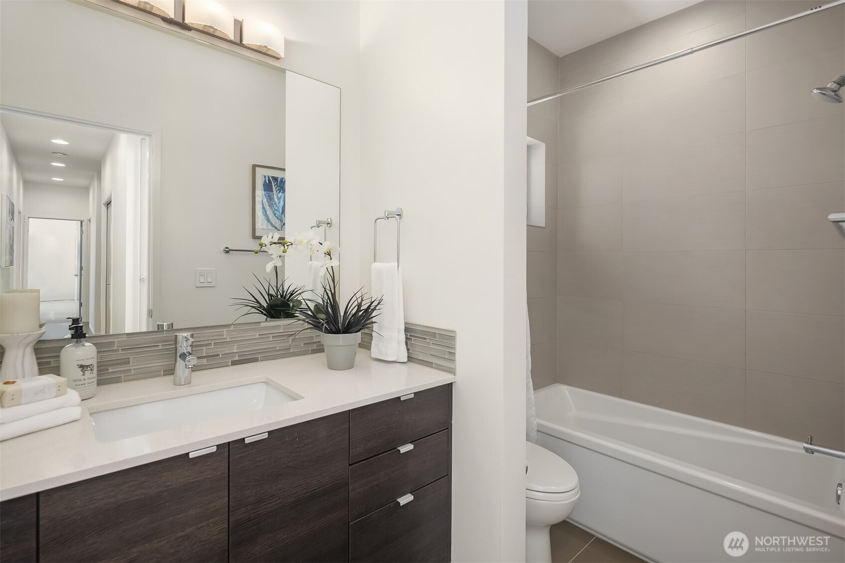 1256 Northeast 89th Street Seattle, WA 98115 - Photo 23 of 37 a bathroom with a granite countertop sink toilet and shower