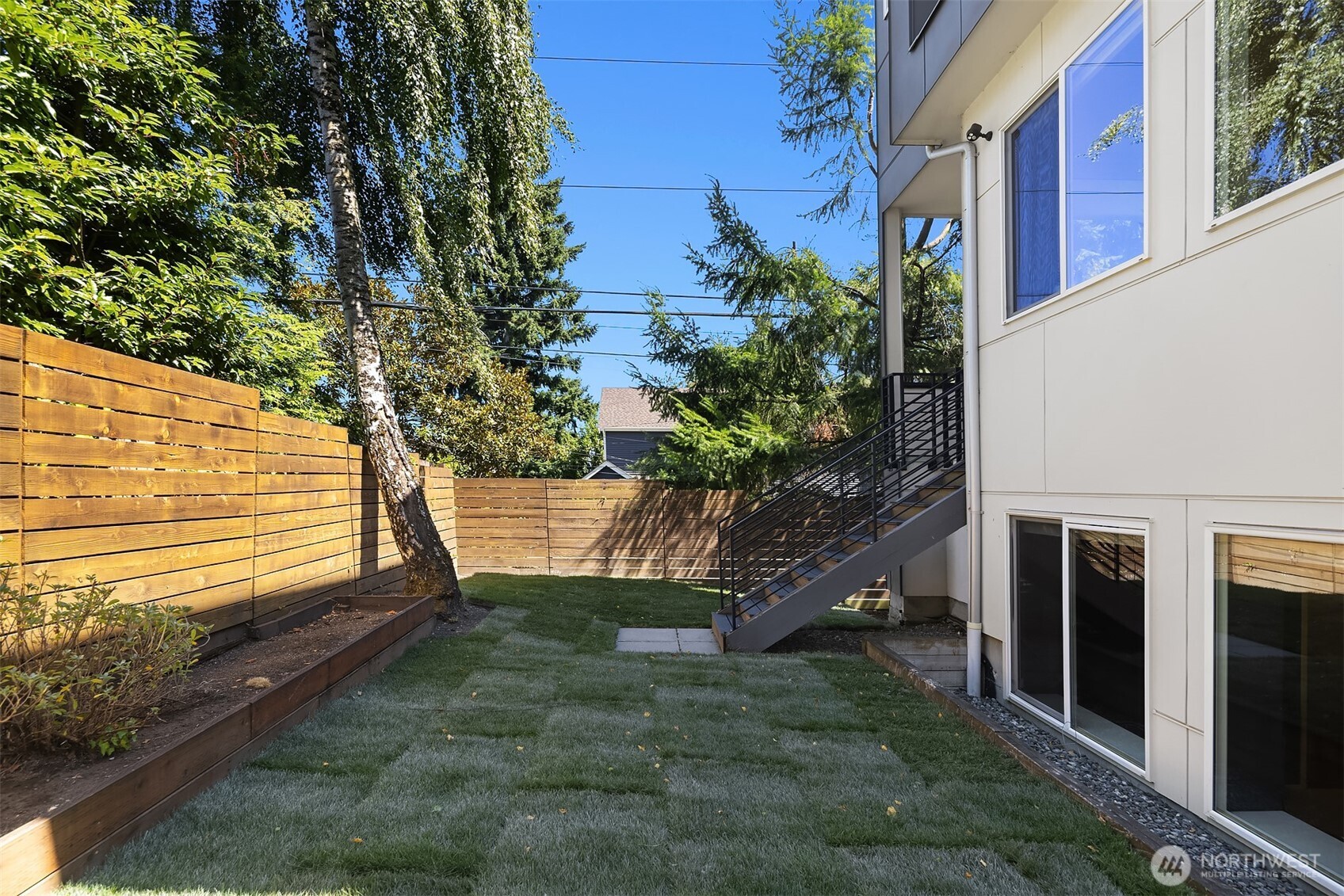 1256 Northeast 89th Street Seattle, WA 98115 - Photo 31 of 37 a view of a house with a yard