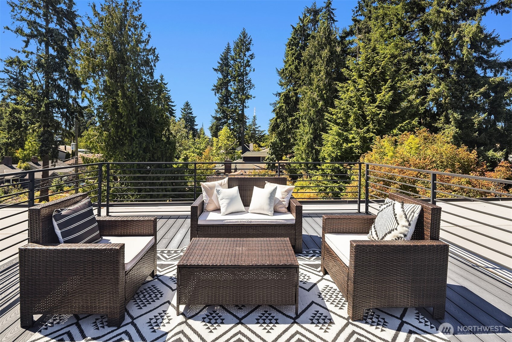 1256 Northeast 89th Street Seattle, WA 98115 - Photo 32 of 37 a view of a patio with couches chairs and a potted plant on a table