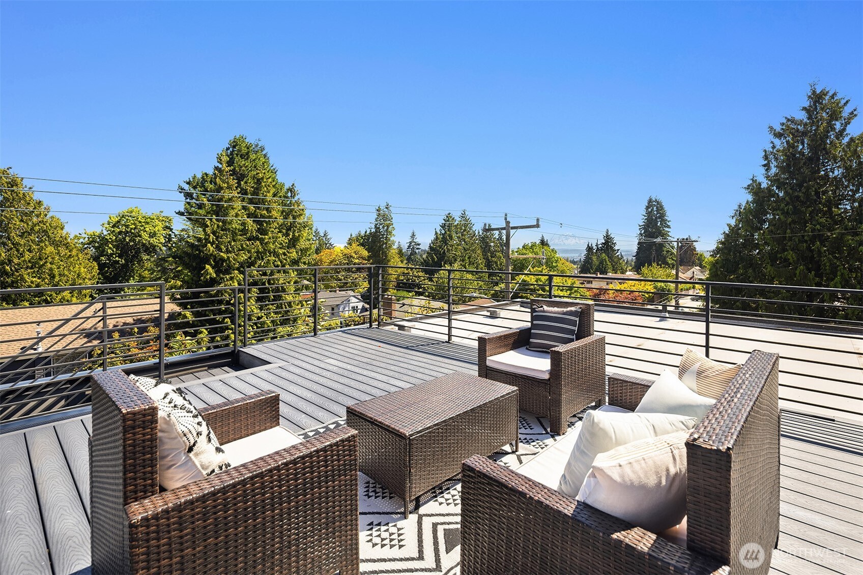 1256 Northeast 89th Street Seattle, WA 98115 - Photo 33 of 37 a view of a patio with couches chairs and a table and chairs