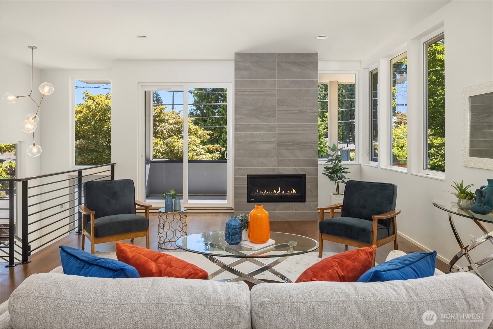 1256 Northeast 89th Street Seattle, WA 98115 - Photo 4 of 37 a living room with furniture and a fireplace