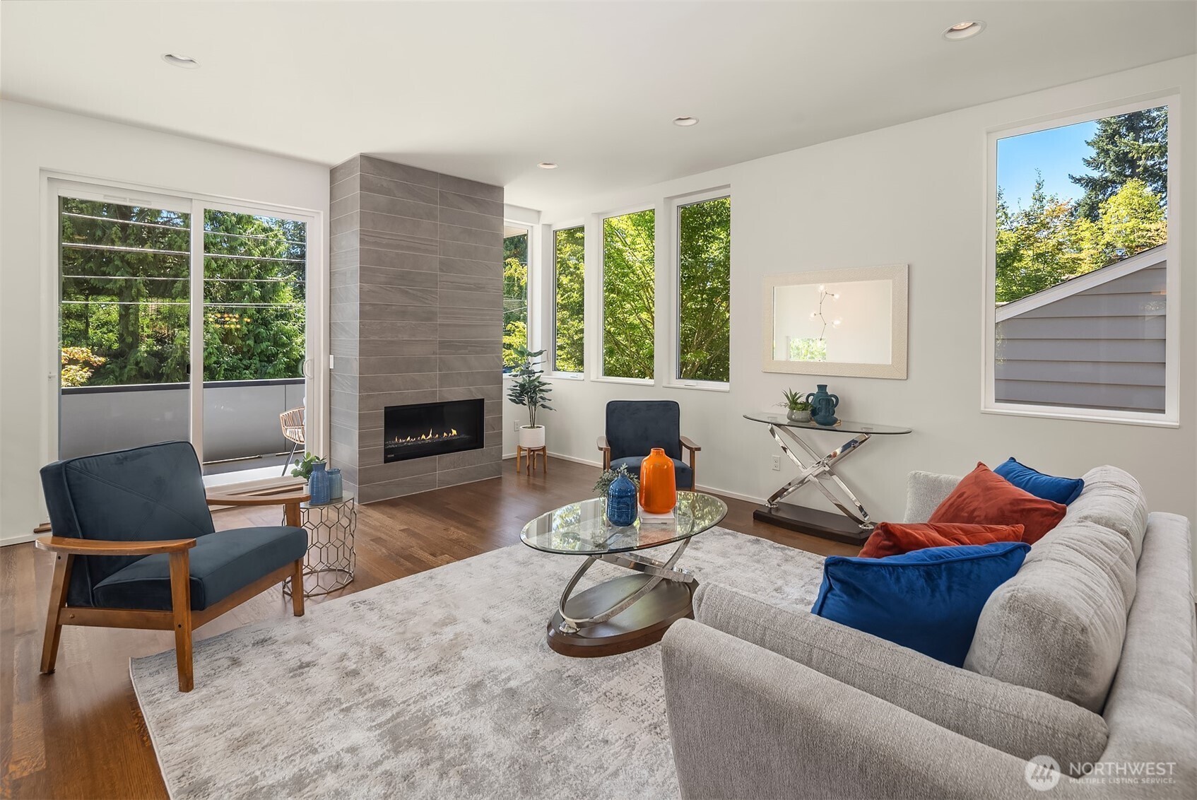 1256 Northeast 89th Street Seattle, WA 98115 - Photo 5 of 37 a living room with furniture a fireplace and a large window