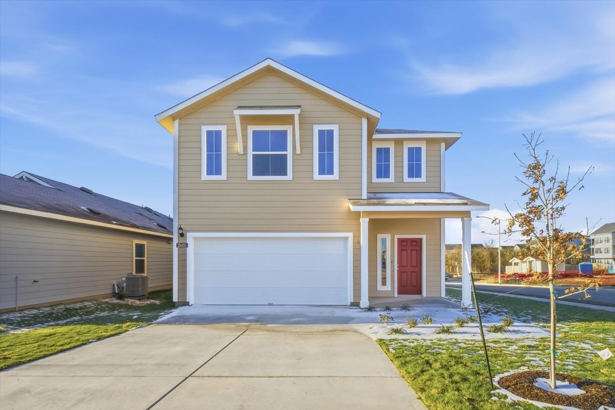 2601 Towy Road Pflugerville, TX 78660 - Photo 3 of 29 Traditional-style home featuring covered porch, a garage, and concrete driveway