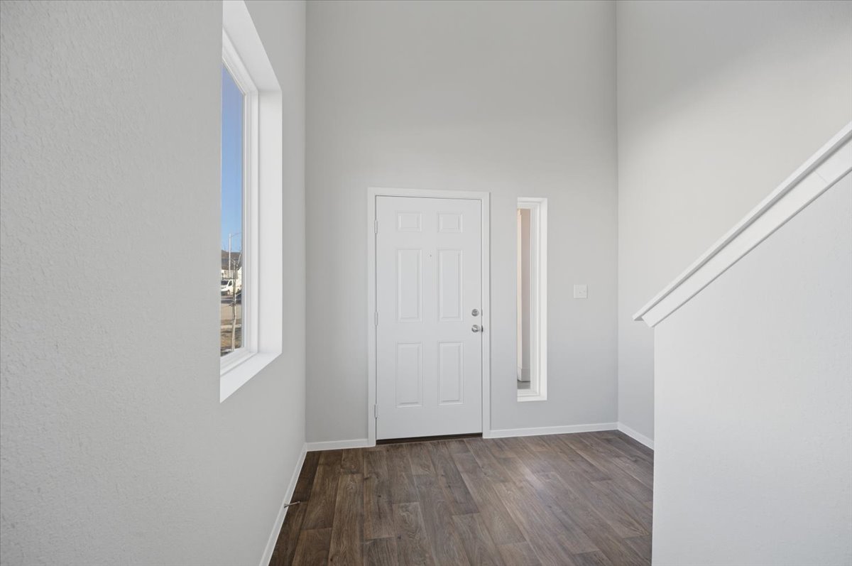 2601 Towy Road Pflugerville, TX 78660 - Photo 4 of 29 Inviting front entry showcasing high ceilings and modern finishes.