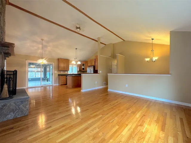 a view of a living room with a wooden floor