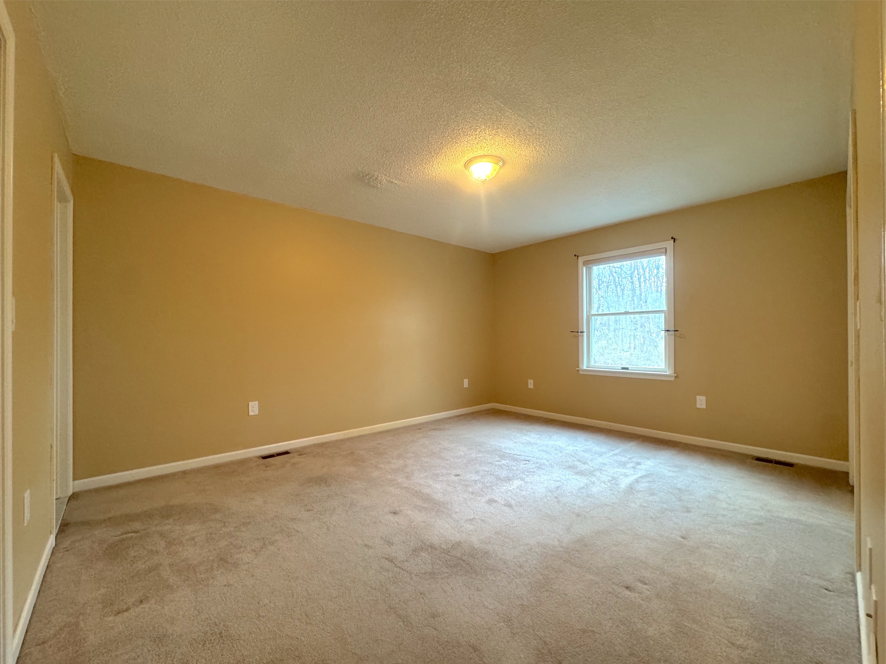 400 Windham Avenue Colchester, CT 06415 - Photo 17 of 33 an empty room with a empty space and windows