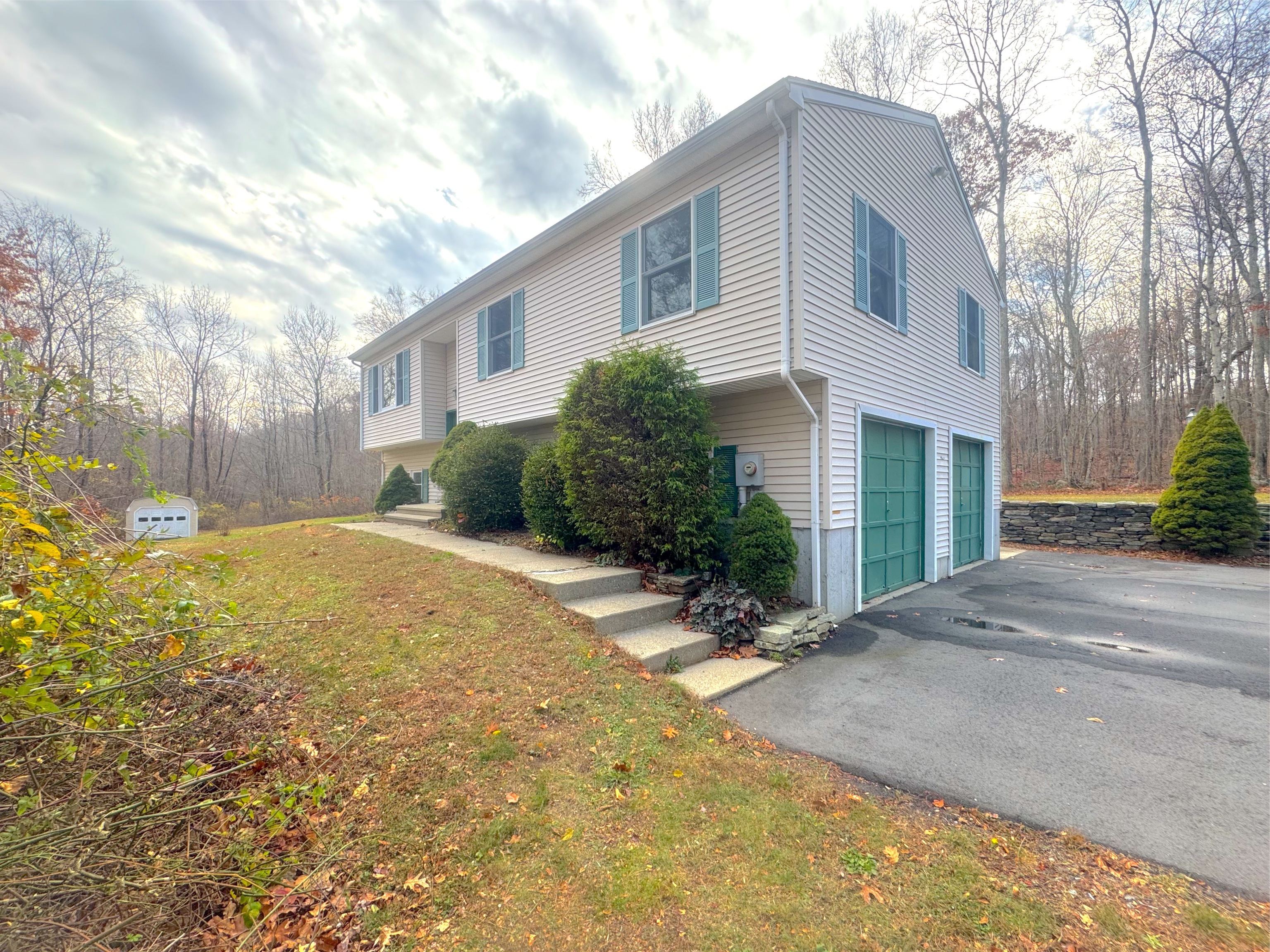 400 Windham Avenue Colchester, CT 06415 - Photo 2 of 33 a front view of a house with a yard and garage