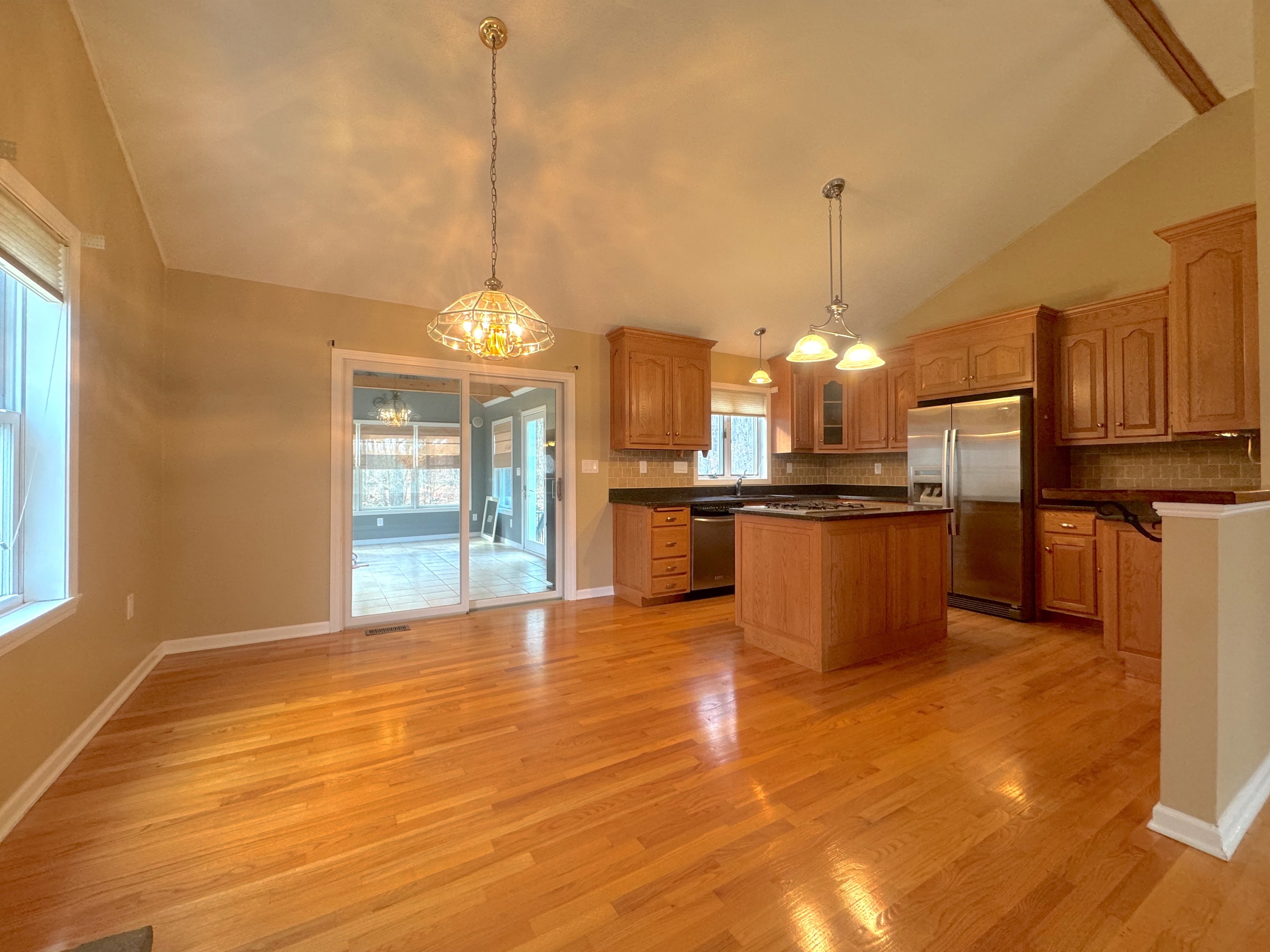 400 Windham Avenue Colchester, CT 06415 - Photo 5 of 33 a view of a kitchen with granite countertop stainless steel appliances and a chandelier