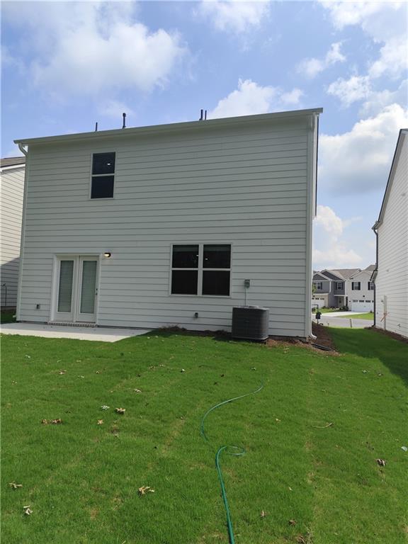 6128 Knickerbocker Street Mableton, GA 30126 - Photo 15 of 16 a backyard of a house with table and chairs