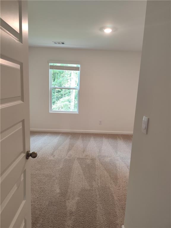 6128 Knickerbocker Street Mableton, GA 30126 - Photo 7 of 16 an empty room with windows