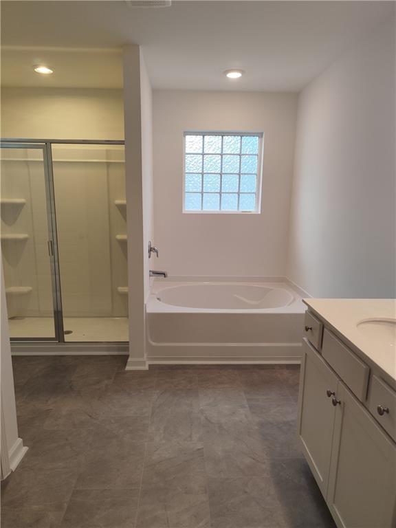 6128 Knickerbocker Street Mableton, GA 30126 - Photo 10 of 16 a spacious bathroom with a tub and shower