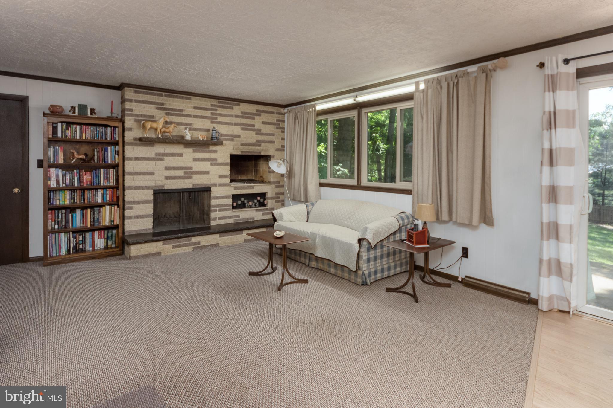 542 Maywood Road York, PA 17402 - Photo 25 of 48 Family room with new carpet, FP & indoor grill