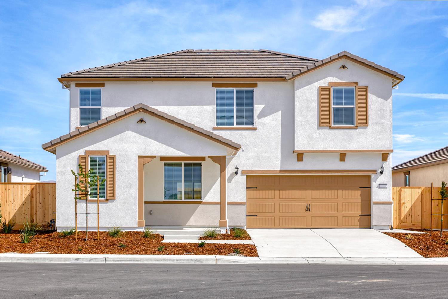 a front view of a house with a garage