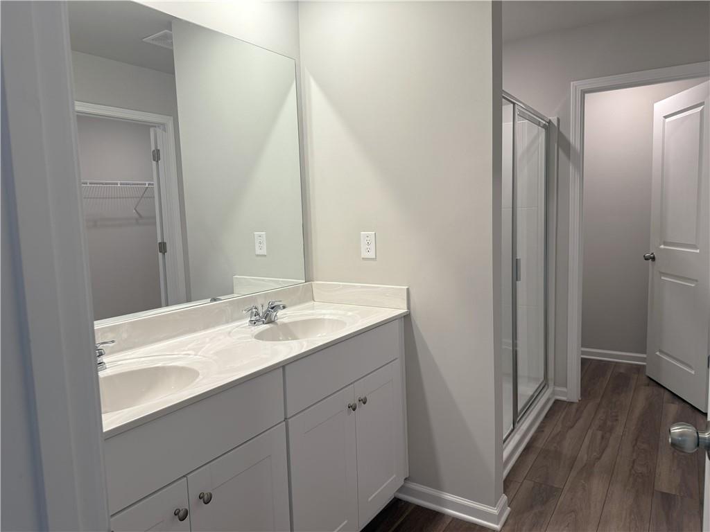 108 Seed Lane Pendergrass, GA 30567 - Photo 7 of 15 a bathroom with a double vanity sink and mirror