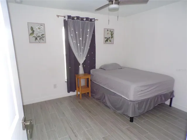 a view of a porch with chairs and backyard