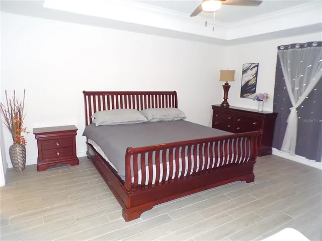 a bed room with a bed and a window