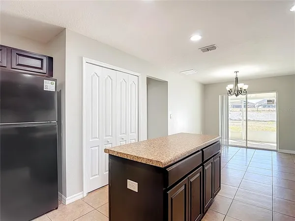 a kitchen with granite countertop stainless steel appliances and sink