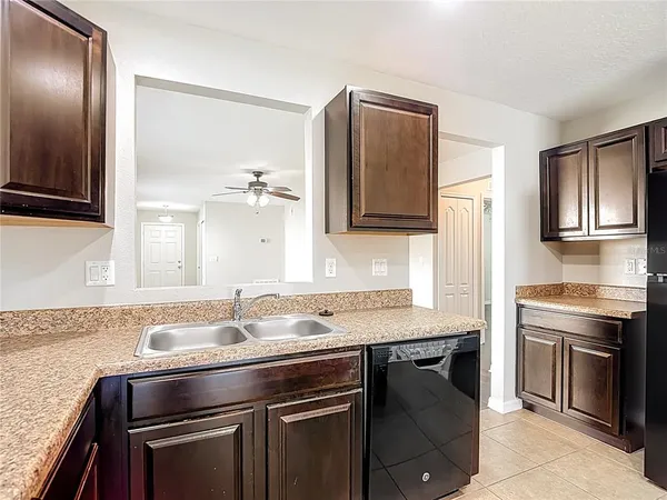 a kitchen with a refrigerator and countertop