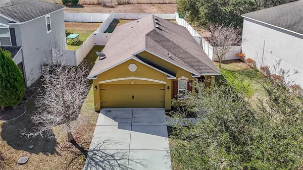 a aerial view of a house with a yard