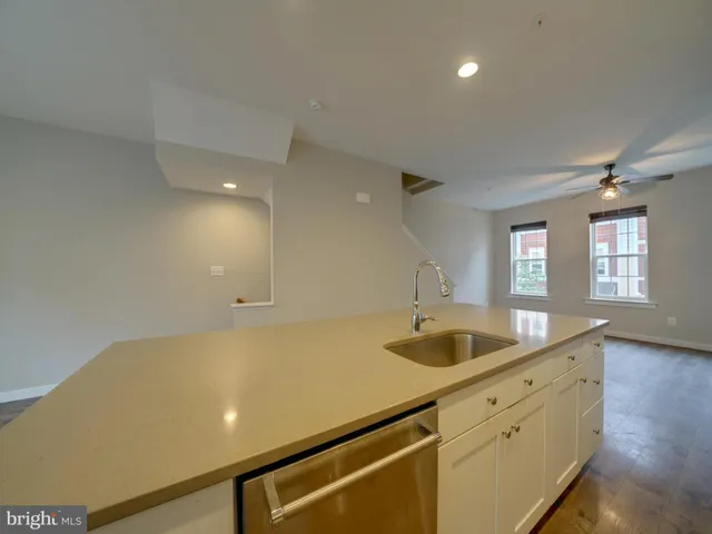 a view of kitchen and wooden floor