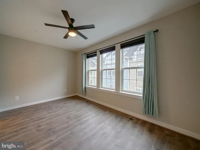 a bathroom with a granite countertop sink a mirror and a