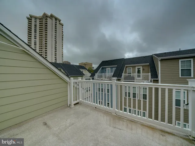a view of balcony with window and wooden floor