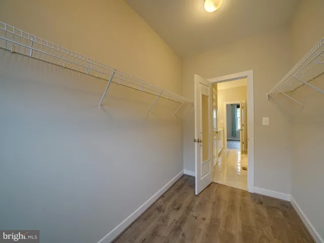 a view of entryway with wooden floor and stairs