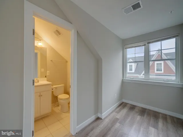 a bathroom with a toilet a sink and shower