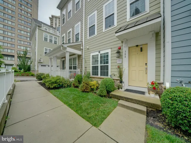front view of a brick house with a yard