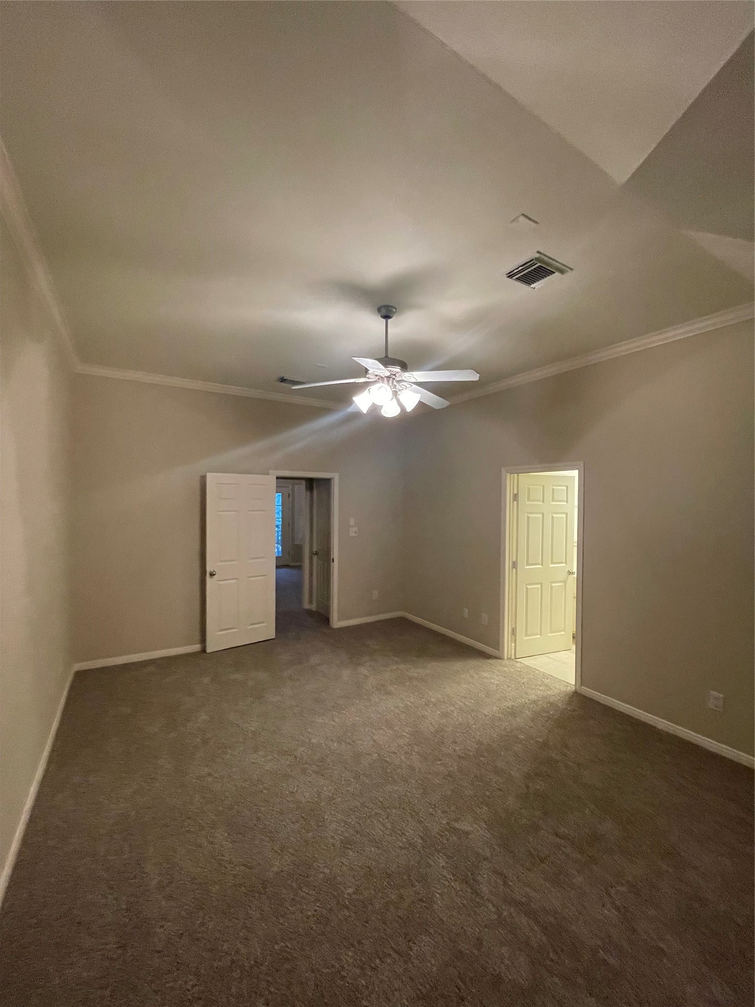 1040 La Rue Street Houston, TX 77019 - Photo 7 of 29 an empty room with a ceiling fan and a window