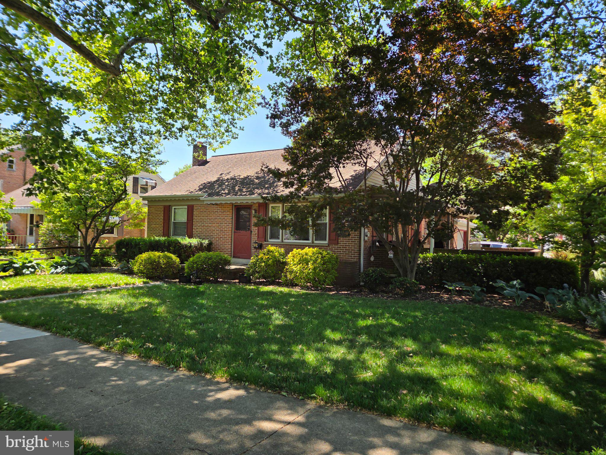 524 Locust Street Denver, PA 17517 - Photo 1 of 36 Charming brick home in lush greenery.