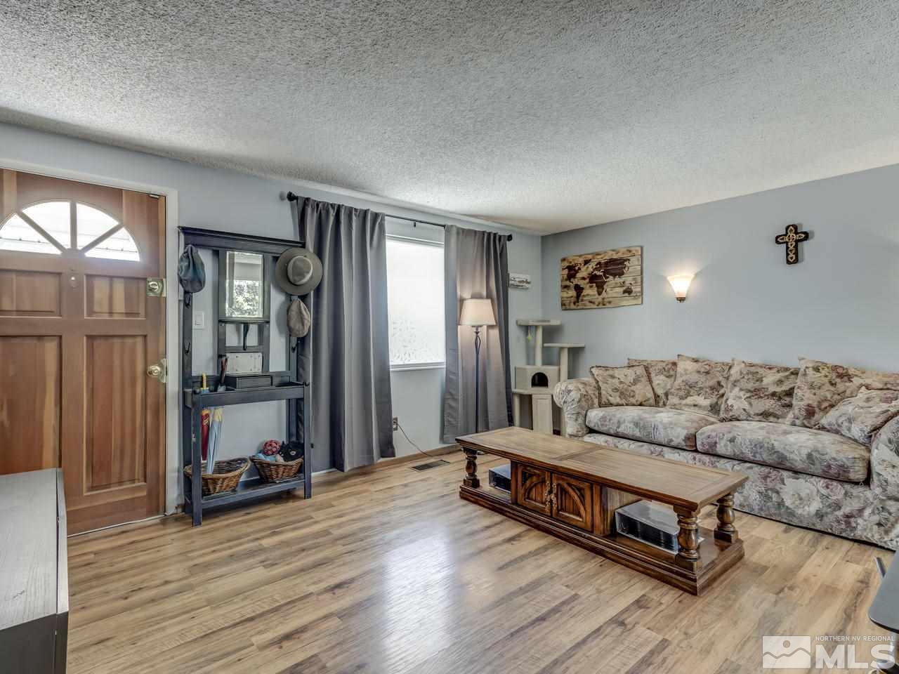 475 Kess Way Reno, NV 89506 - Photo 5 of 25 a living room with furniture and a wooden floor