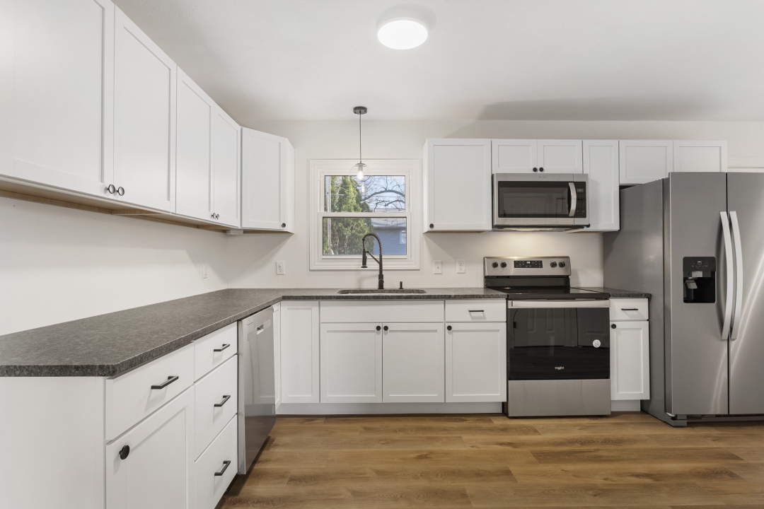 2803 Maplewood Drive Champaign, IL 61821 - Photo 12 of 39 a kitchen with cabinets stainless steel appliances and a counter space
