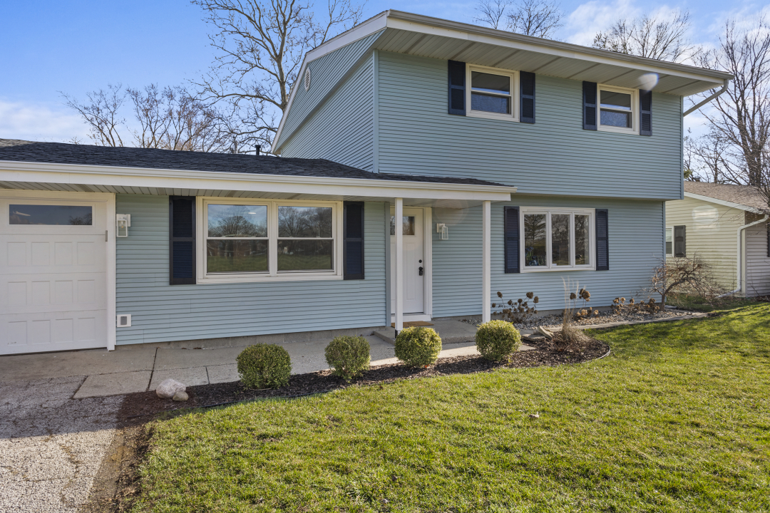 2803 Maplewood Drive Champaign, IL 61821 - Photo 18 of 39 a front view of a house with garden