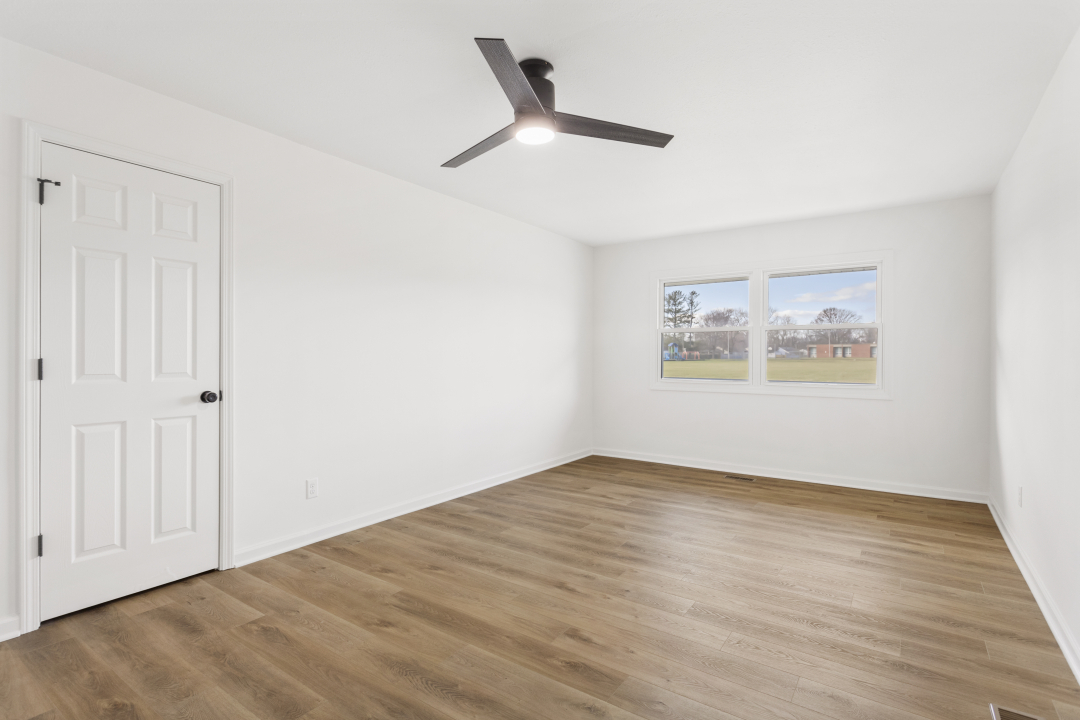2803 Maplewood Drive Champaign, IL 61821 - Photo 23 of 39 a view of an empty room with wooden floor